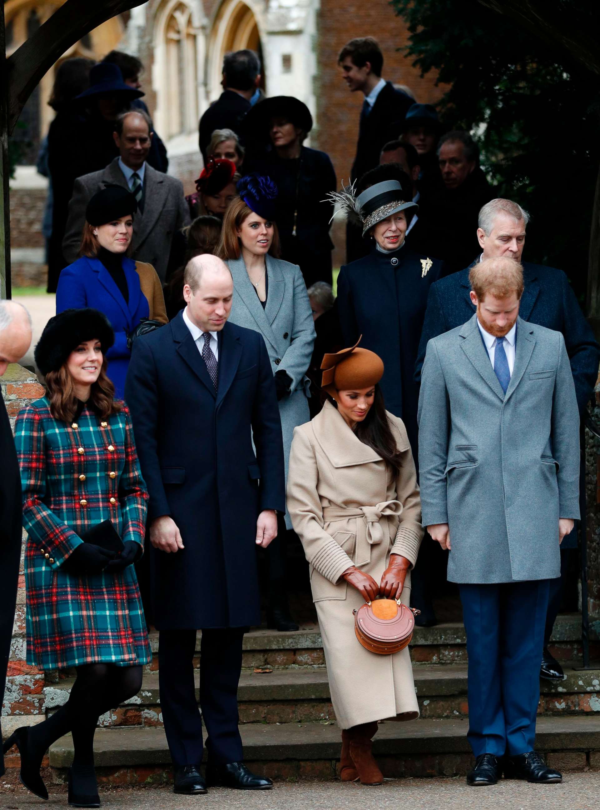 PHOTO: Actress and fiancee of Prince Harry Meghan Markle and Britain's Catherine, Duchess of Cambridge,  curtsy, and Prince William, Duke of Cambridge and Prince Harry bow to Queen Elizabeth II in Sandringham, Norfolk, eastern England, Dec. 25, 2017. 