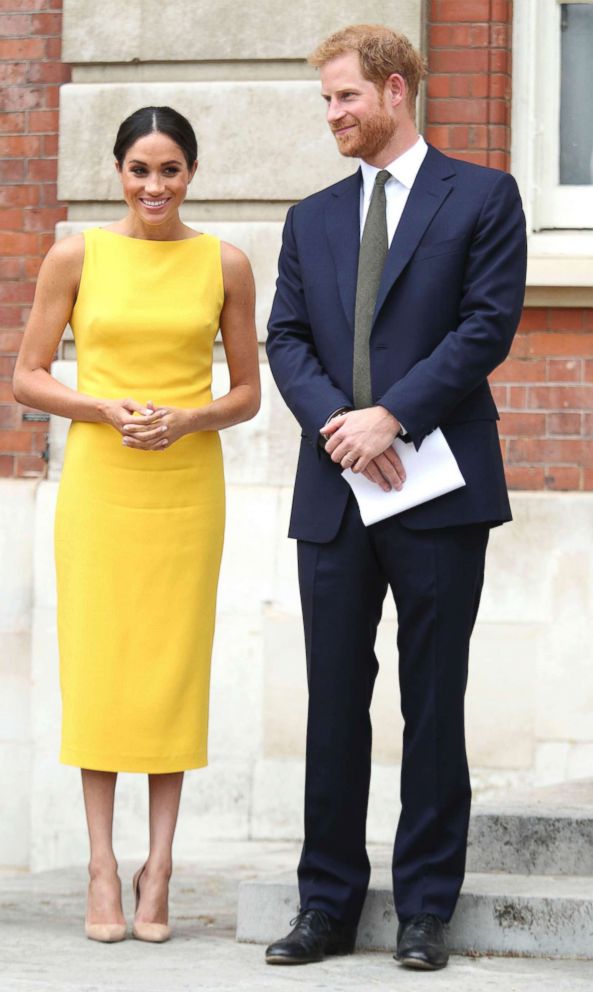 PHOTO: Meghan Markle, the Duchess of Sussex and Britain's Prince Harry stand as they attend the 'Your Commonwealth' Youth Challenge reception where they will meet youngsters from across the Commonwealth, at Marlborough House in London, July 5, 2018.