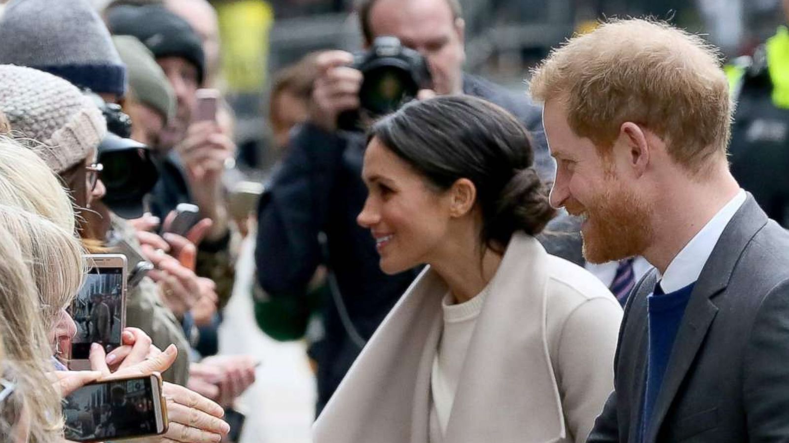 PHOTO: Britain's Prince Harry and his fiancee, Meghan Markle, greet well-wishers after a visit at the historic building, The Crown Liquor Saloon in Belfast, March 23, 2018, where they will learn of the pub's heritage from members of the National Trust.