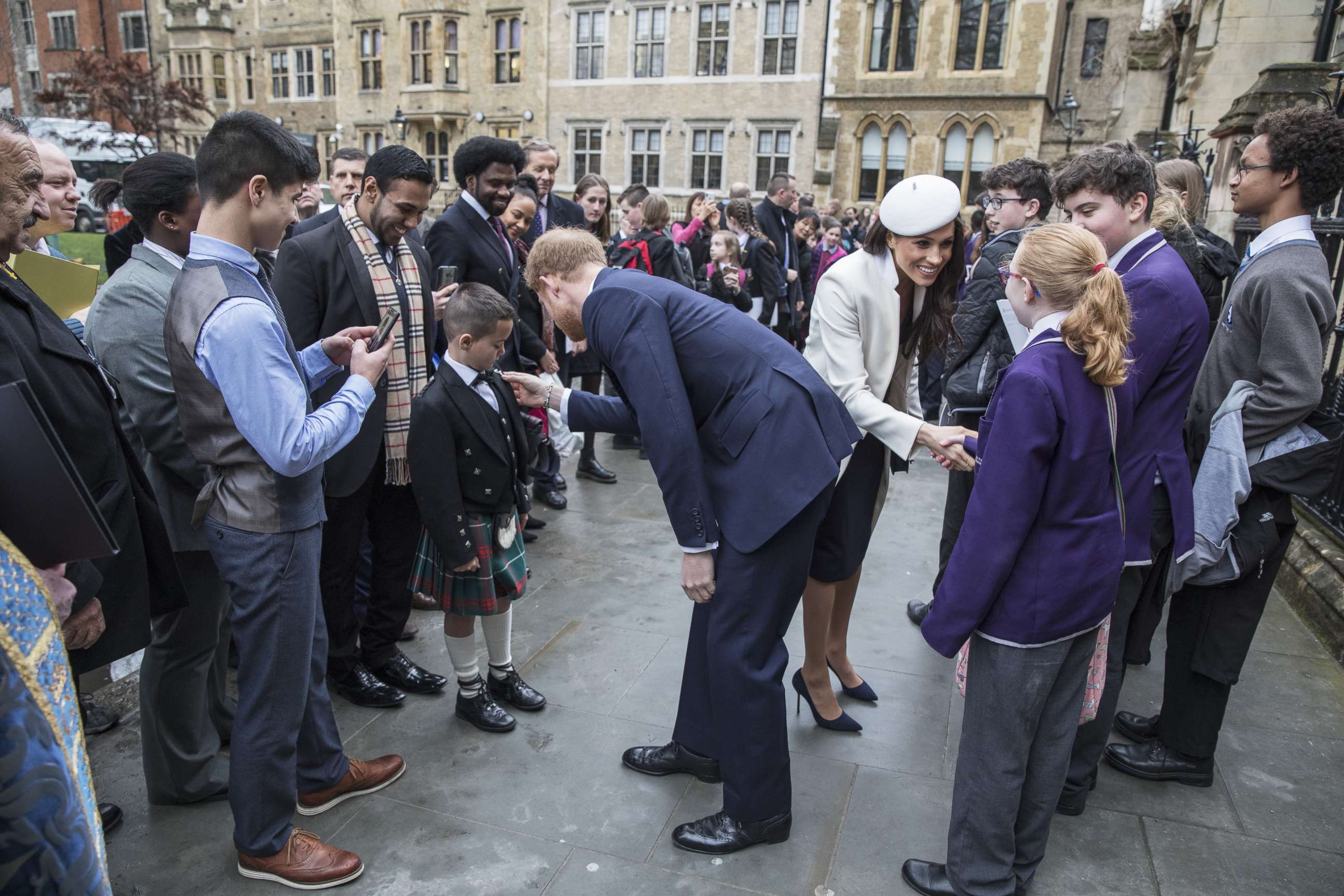 PHOTO: Prince Harry and Meghan Markle meet school children in the Dean's yard before attending a Reception after attending the Commonwealth Service at Westminster Abbey, March 12, 2018, in London.
