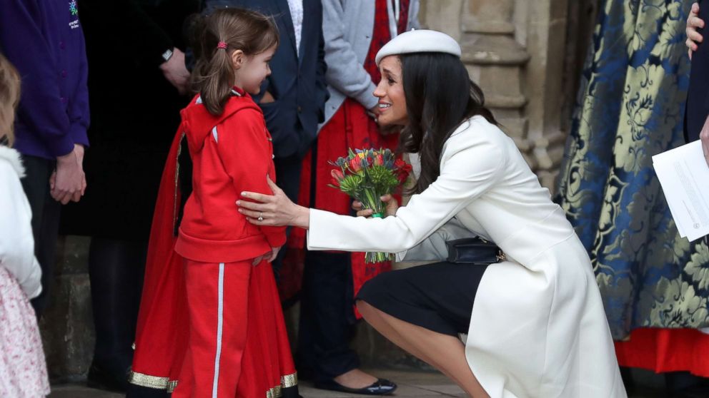 PHOTO: Actress Meghan Markle, fiancee of Britain's Prince Harry, receives a posy of flowers from a young girl after attending a Commonwealth Day Service at Westminster Abbey in central London, March 12, 2018.