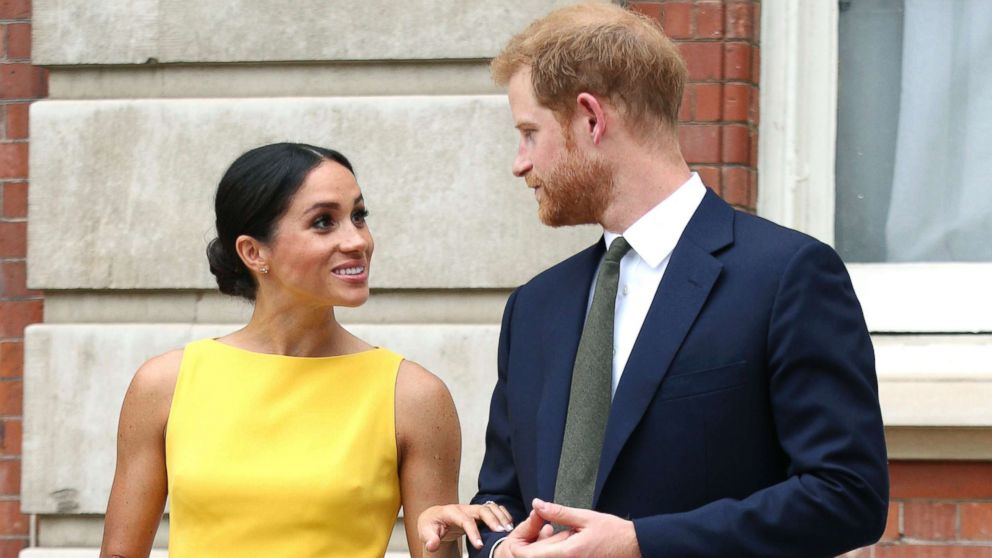 PHOTO: Meghan Markle, the Duchess of Sussex and Britain's Prince Harry, the Duke of Sussex stand as they attend a reception where they will meet youngsters from across the Commonwealth, at Marlborough House in London, July 5, 2018.