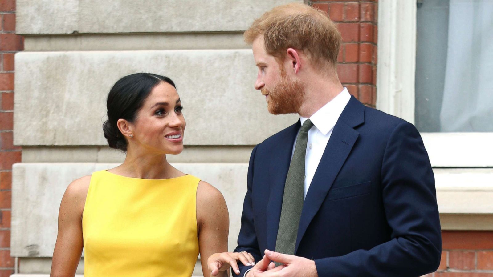 PHOTO: Meghan Markle, the Duchess of Sussex and Britain's Prince Harry, the Duke of Sussex stand as they attend a reception where they will meet youngsters from across the Commonwealth, at Marlborough House in London, July 5, 2018.