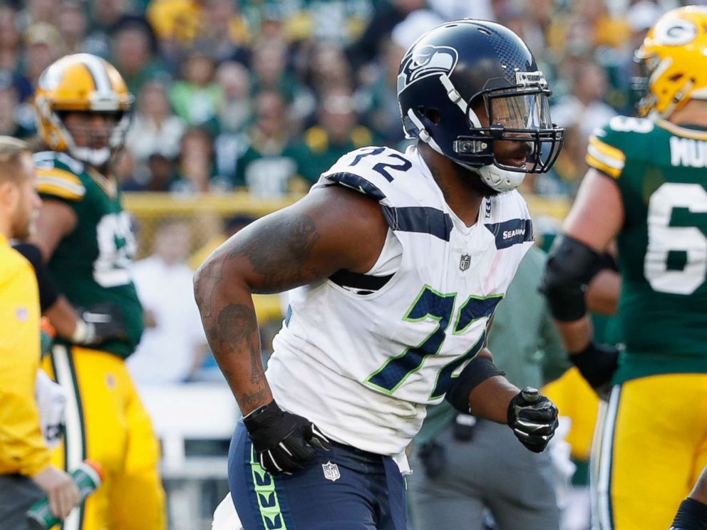 PHOTO: Michael Bennett of the Seattle Seahawks walks off the field during the second half against the Green Bay Packers at Lambeau Field, Sept. 10, 2017, in Green Bay, Wis.