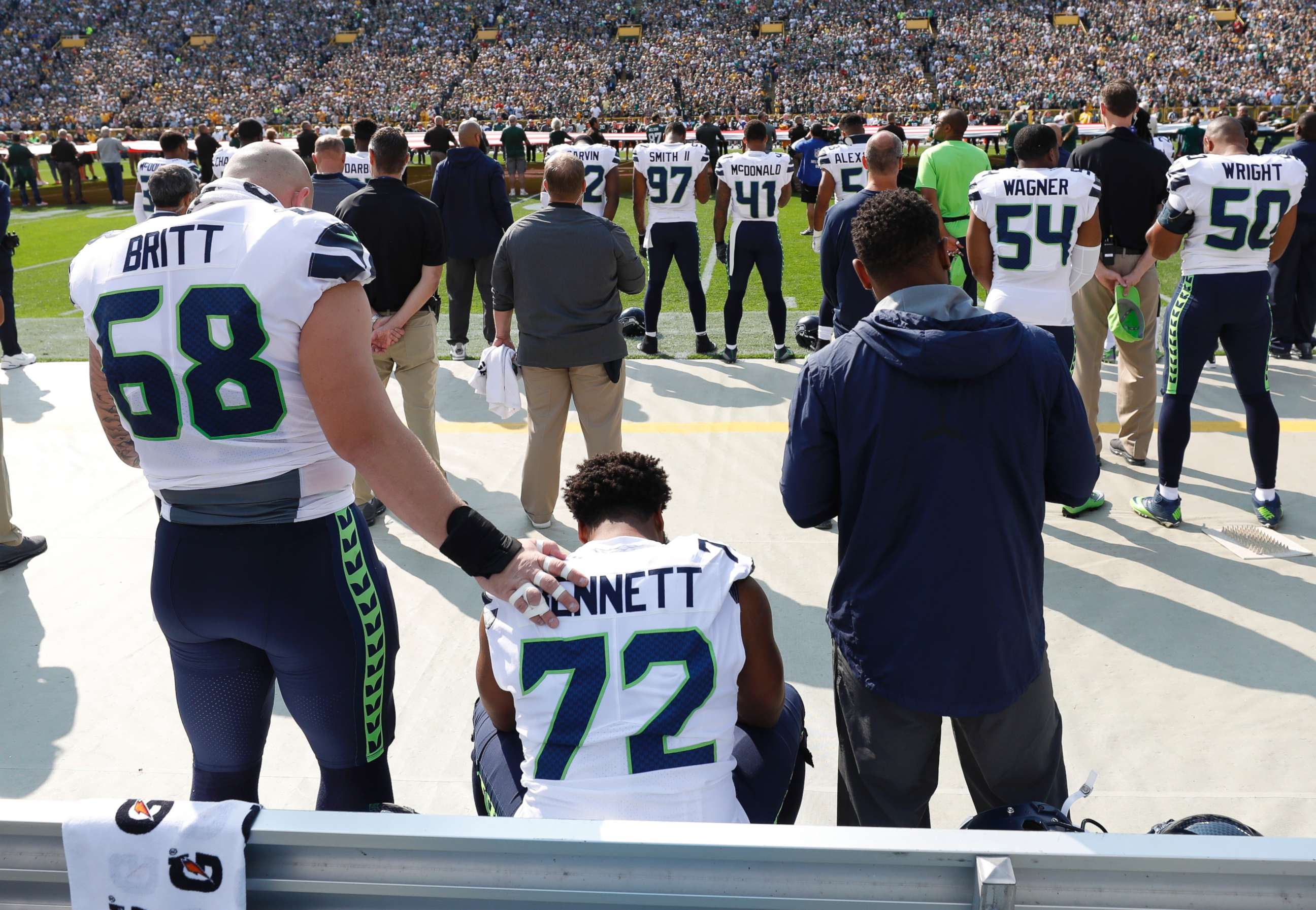 PHOTO: Seattle Seahawks' Michael Bennett remains seated on the bench during the national anthem before an NFL football game against the Green Bay Packers Sunday, Sept. 10, 2017, in Green Bay, Wis.