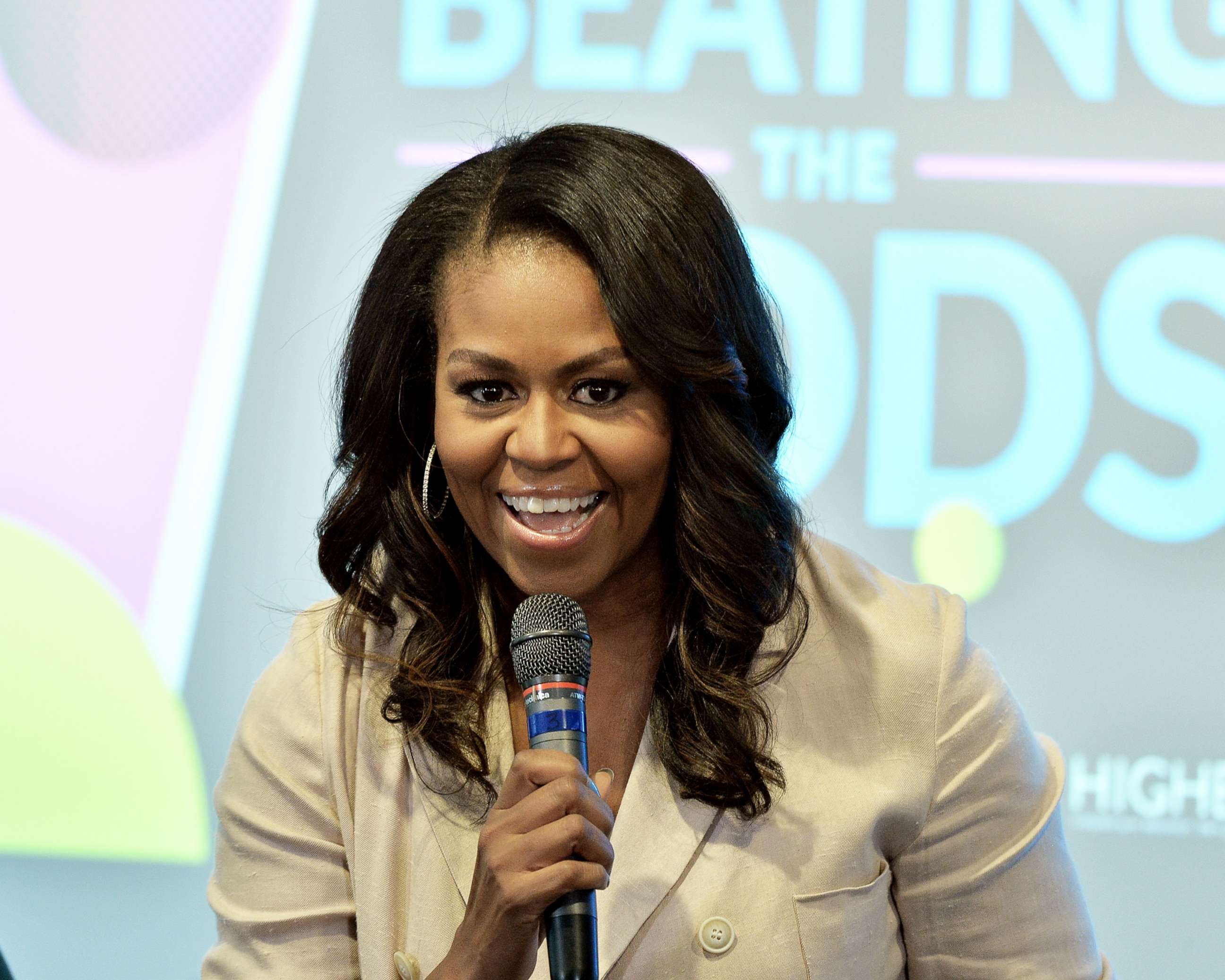 PHOTO: Former First Lady Michelle Obama talks to the audience at the Reach Higher Initiative Beating the Odds Summit to support first-generation college-bound students on June 14, 2018, in Washington, D.C.