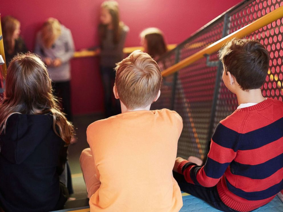 PHOTO: Middle-school aged students sit on a school stairwell in an undated stock photo.