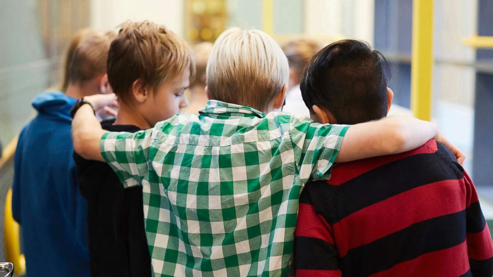 PHOTO: Middle-school aged boys stand in a hallway in an undated stock photo.