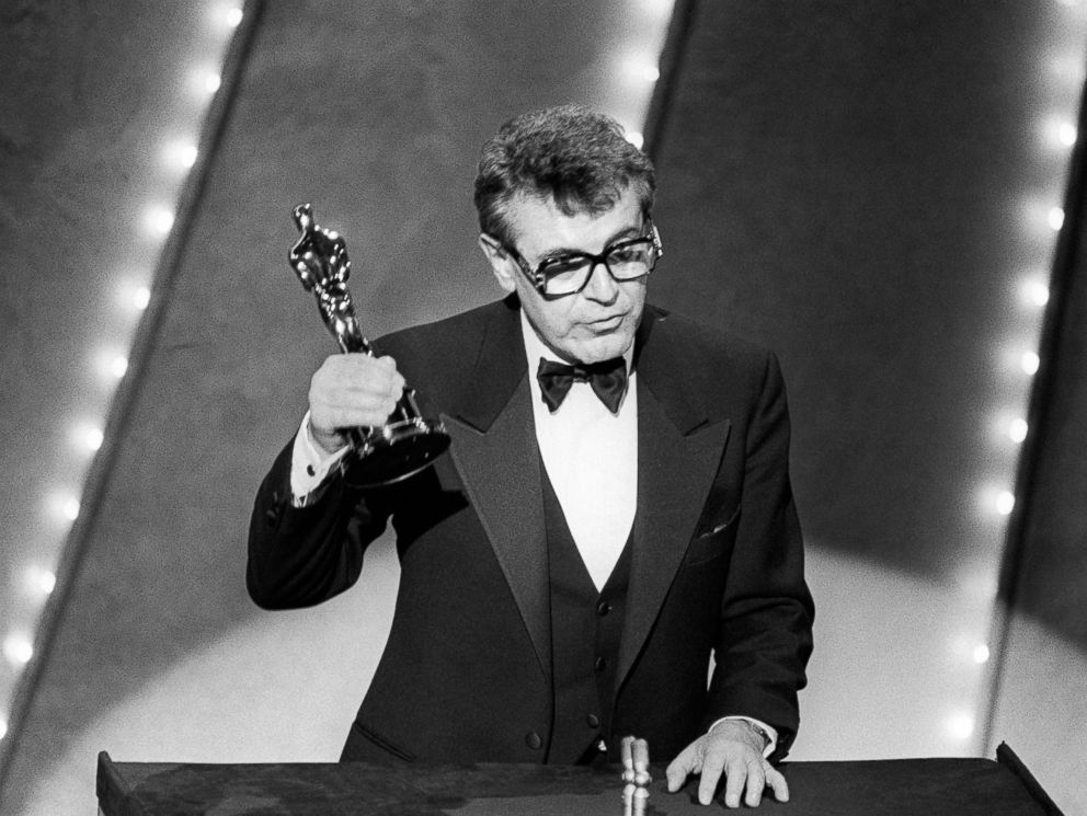 PHOTO: In this file photo taken on March 25, 1985 Czech-born U.S. film director Milos Forman holds up his Oscar trophy for his film Amadeus at the 57th Annual Academy Awards in Hollywood, Calif.