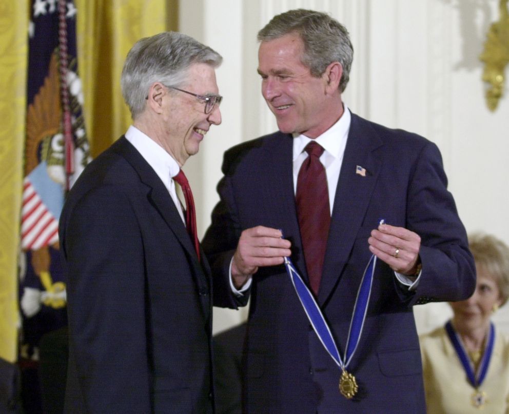 PHOTO: President Bush, right, prepares to place the Presidential Medal of Freedom on Fred Rogers, left, star of "Mr. Rogers Neighborhood,"  a children's show which is the longest running program on public television. This ceremony was held July 9, 2002.