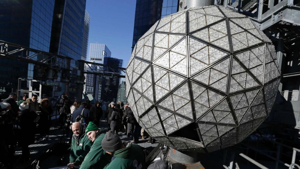 PHOTO: Workers prepare to install the last panels on the New Year's Eve ball above Times Square, New York, Dec. 27, 2017.