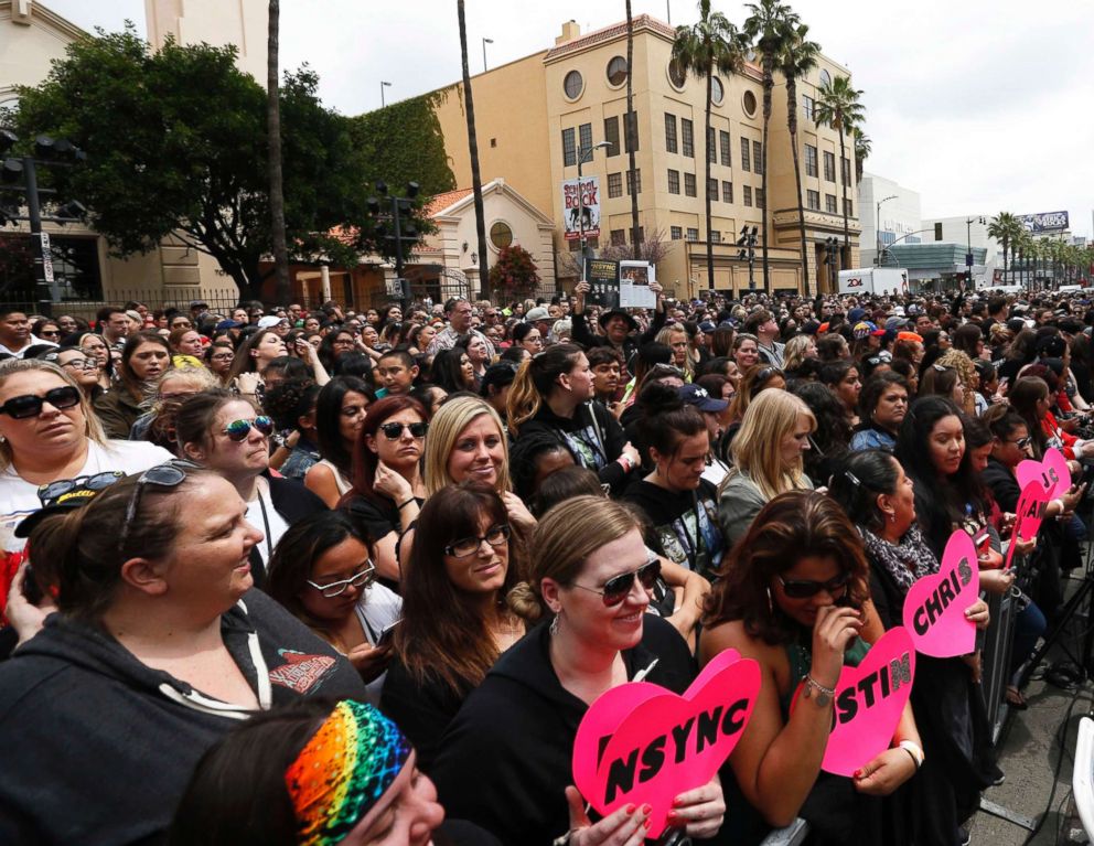 PHOTO: Fans wait for the unveiling ceremony of the star for American boy band NSYNC on the Hollywood Walk of Fame in Los Angeles, April 30, 2018.