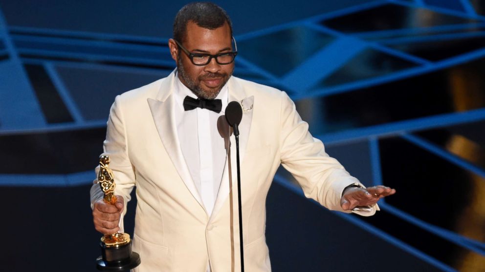 Jordan Peele accepts the award for best original screenplay for "Get Out" at the Oscars at the Dolby Theatre in Los Angeles, March 4, 2018.