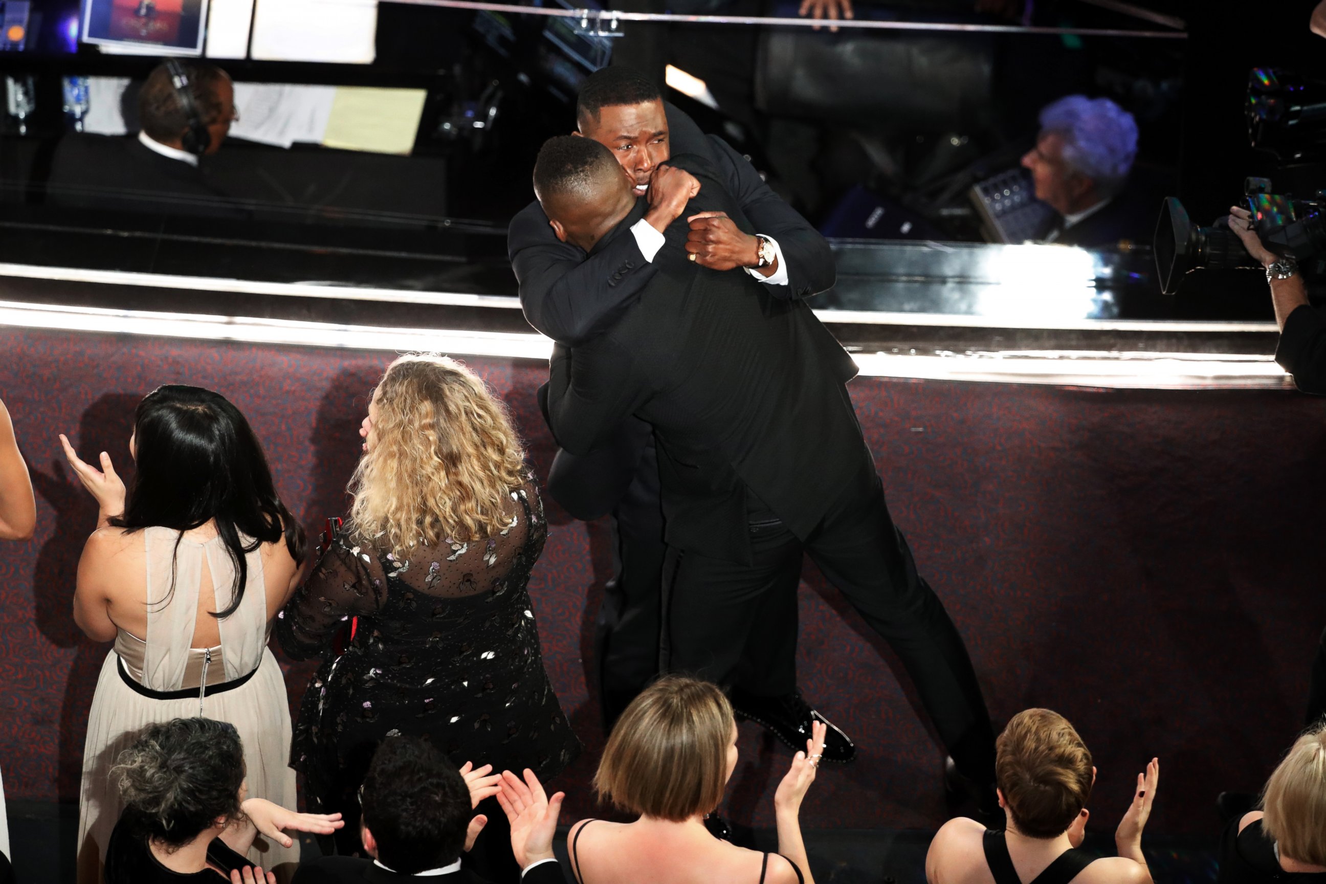 PHOTO: "Moonlight" castmembers Mahershala Ali and Trevante Rhodes hug after it was announced that the movie won Best Picture during the telecast of the 89th Academy Awards on Feb. 26, 2017 in Hollywood, Calif.