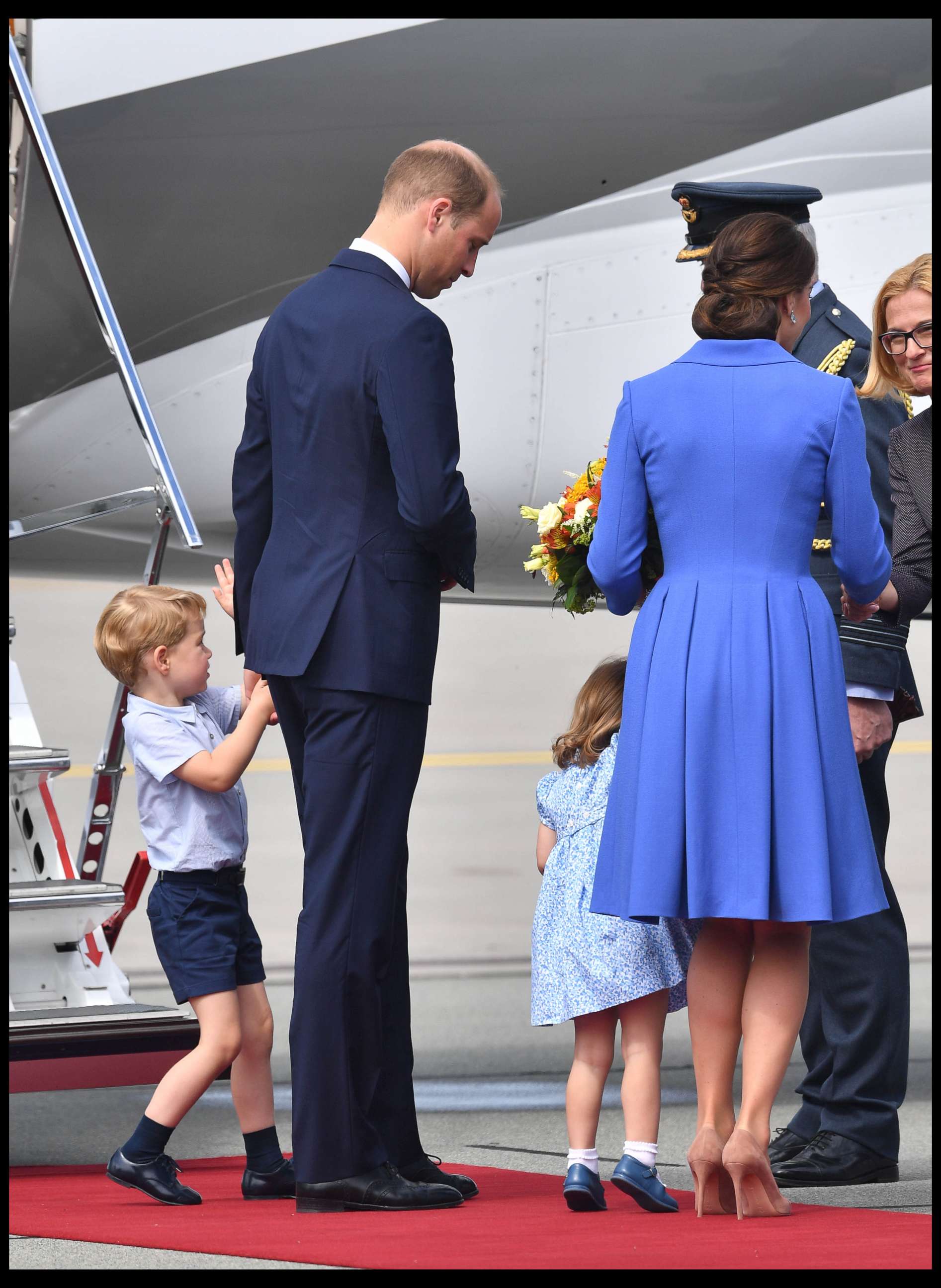 PHOTO: Prince William, Catherine The Duchess of Cambridge with their children Prince George and Princess Charlotte depart Warsaw airport in Poland after a three day visit, July 19, 2017.