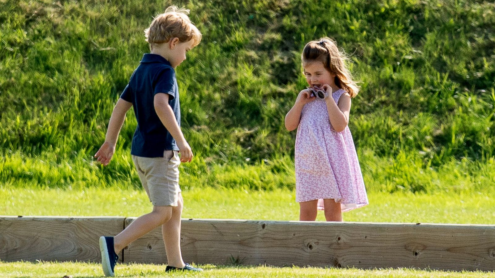 PHOTO: Prince George of Cambridge and Princess Charlotte of Cambridge during the Festival of Polo at the Beaufort Polo Club in Tetbury, Gloucestershire, England, June 10, 2018.