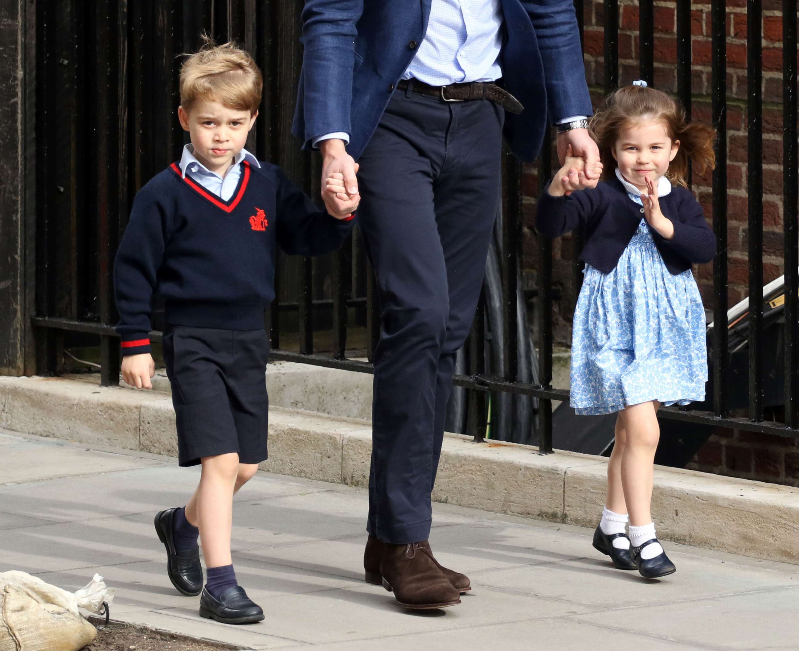 PHOTO: Prince George, Prince William and Princess Charlotte outside the Lindo Wing of St Mary's Hospital, April 23, 2018, in London.