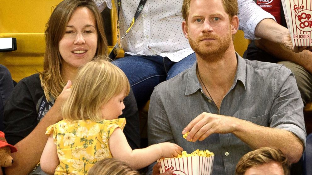 PHOTO: Prince Harry watches seated volleyball with Dave Henson, his wife Hayley Henson, and their two-year-old daughter Emily from the stands during the Invictus Games at the Mattamy Athletics Center, Sept. 27, 2017 in Toronto.
