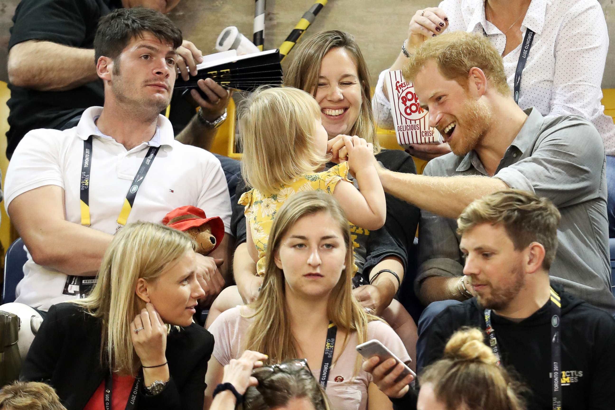 PHOTO: Athlete David Henson (L), wife Hayley Henson, and daughter Emily Henson sit with Prince Harry at the Sitting Volleyball Finals during the Invictus Games 2017 at Mattamy Athletic Center, Sept. 27, 2017 in Toronto.  