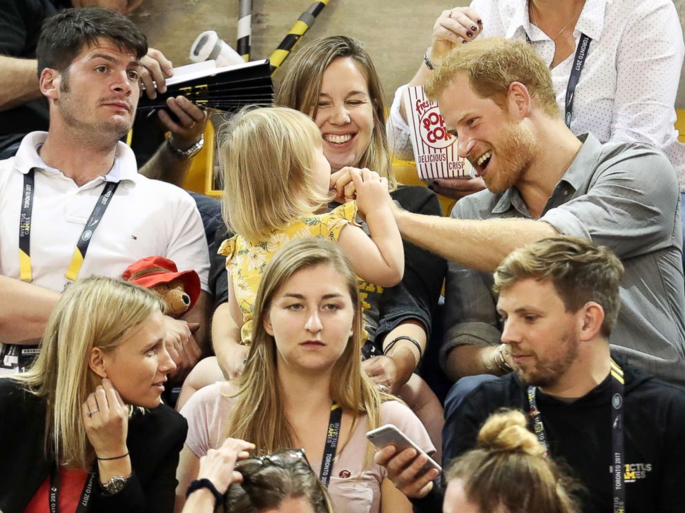 PHOTO: Athlete David Henson (L), wife Hayley Henson, and daughter Emily Henson sit with Prince Harry at the Sitting Volleyball Finals during the Invictus Games 2017 at Mattamy Athletic Center, Sept. 27, 2017 in Toronto.