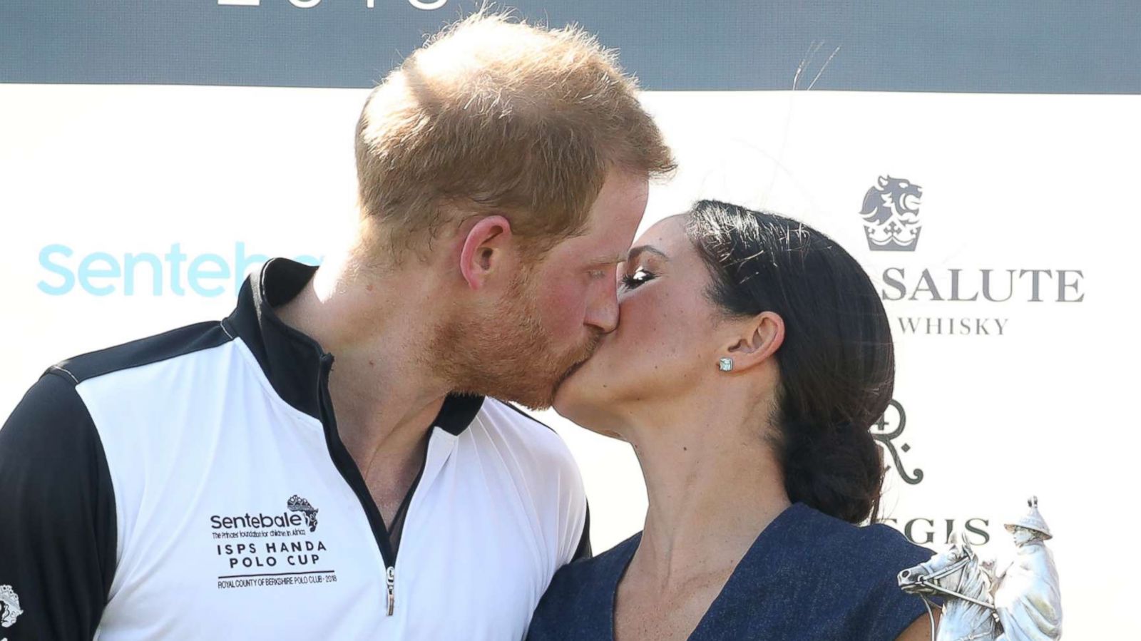 PHOTO: Meghan, Duchess of Sussex, and Prince Harry, Duke of Sussex, kiss after the Sentebale Polo 2018 held at the Royal County of Berkshire Polo Club, July 26, 2018, in Windsor, England.