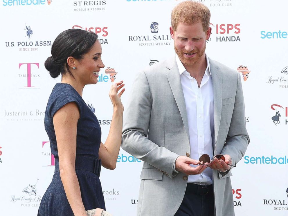 PHOTO: Britains Prince Harry and Meghan the Duchess of Sussex arrive at a charity polo match in Windsor, July 26, 2018.
