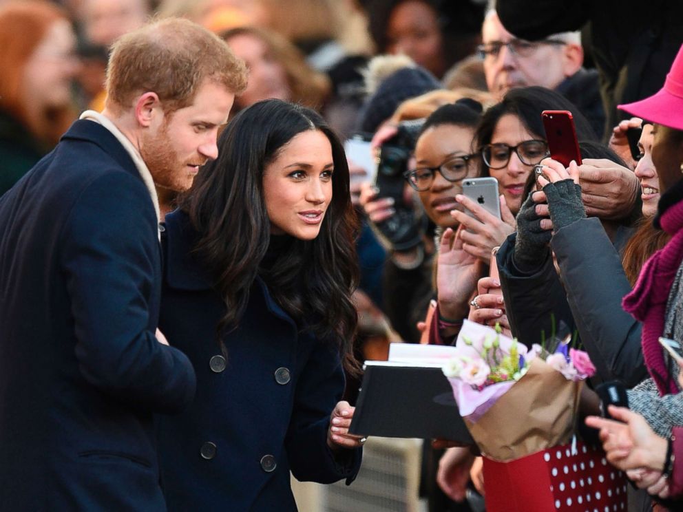 PHOTO: Britains Prince Harry and his fiancee Meghan Markle greet well wishers as they arrive for the Terrence Higgins Trust World AIDS Day charity fair in Nottingham, England, Dec. 1, 2017.