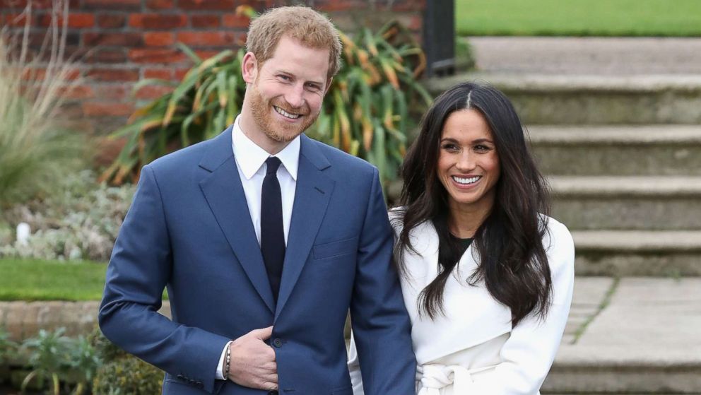 Prince Harry and Meghan Markle pose for photographers during the announcement of their engagement at the Sunken Gardens at Kensington Palace on Nov. 27, 2017 in London.
