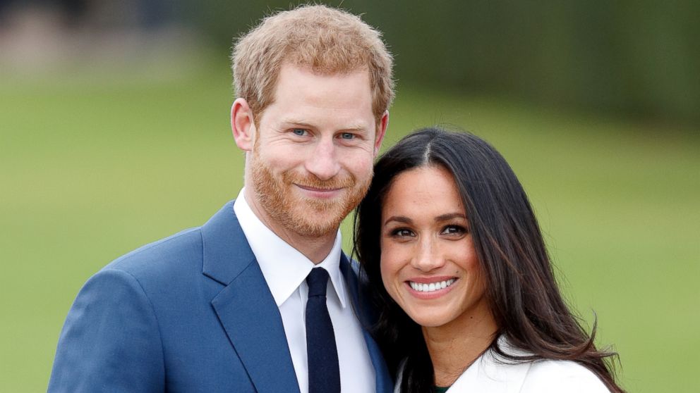 Britain's Prince Harry poses with his fiancee Meghan Markle during a photocall after announcing their engagement in the Sunken Garden at Kensington Palace in London, Nov. 27, 2017.