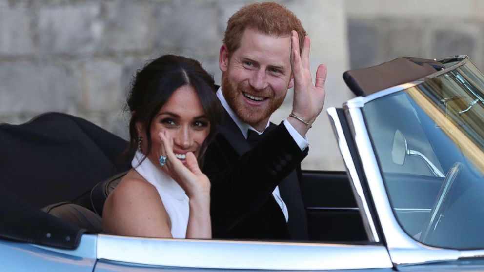 The newly married Duke and Duchess of Sussex, Prince Harry and Meghan Markle, leave Windsor Castle in a convertible car after their wedding in Windsor, England, to attend an evening reception at Frogmore House, hosted by the Prince of Wales, May 19, 2018.