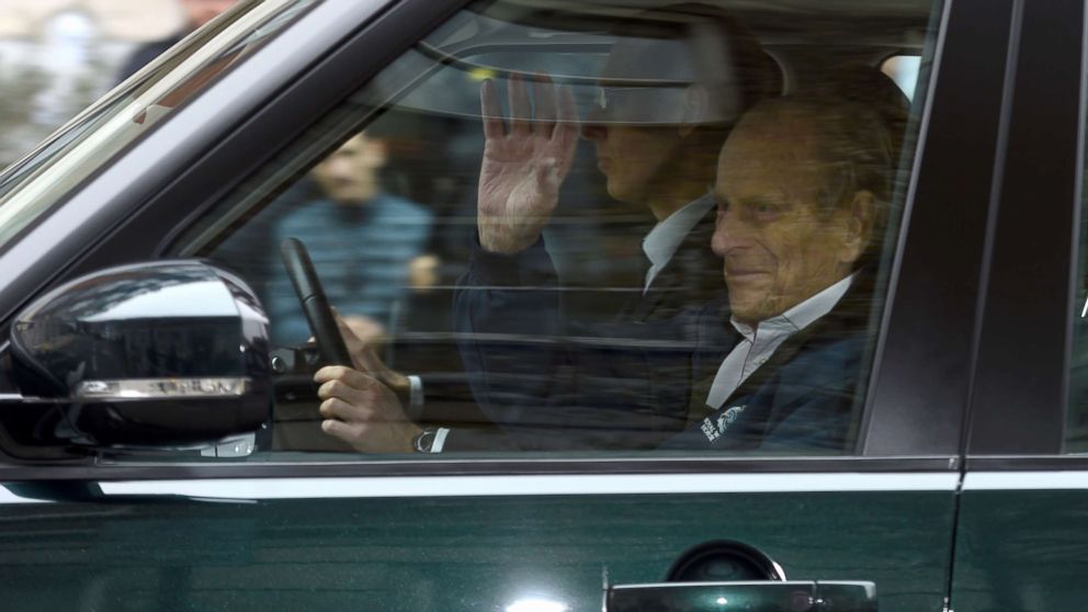 PHOTO: Prince Philip waves as he is driven away from King Edward VII's Hospital in central London, April 13, 2018.