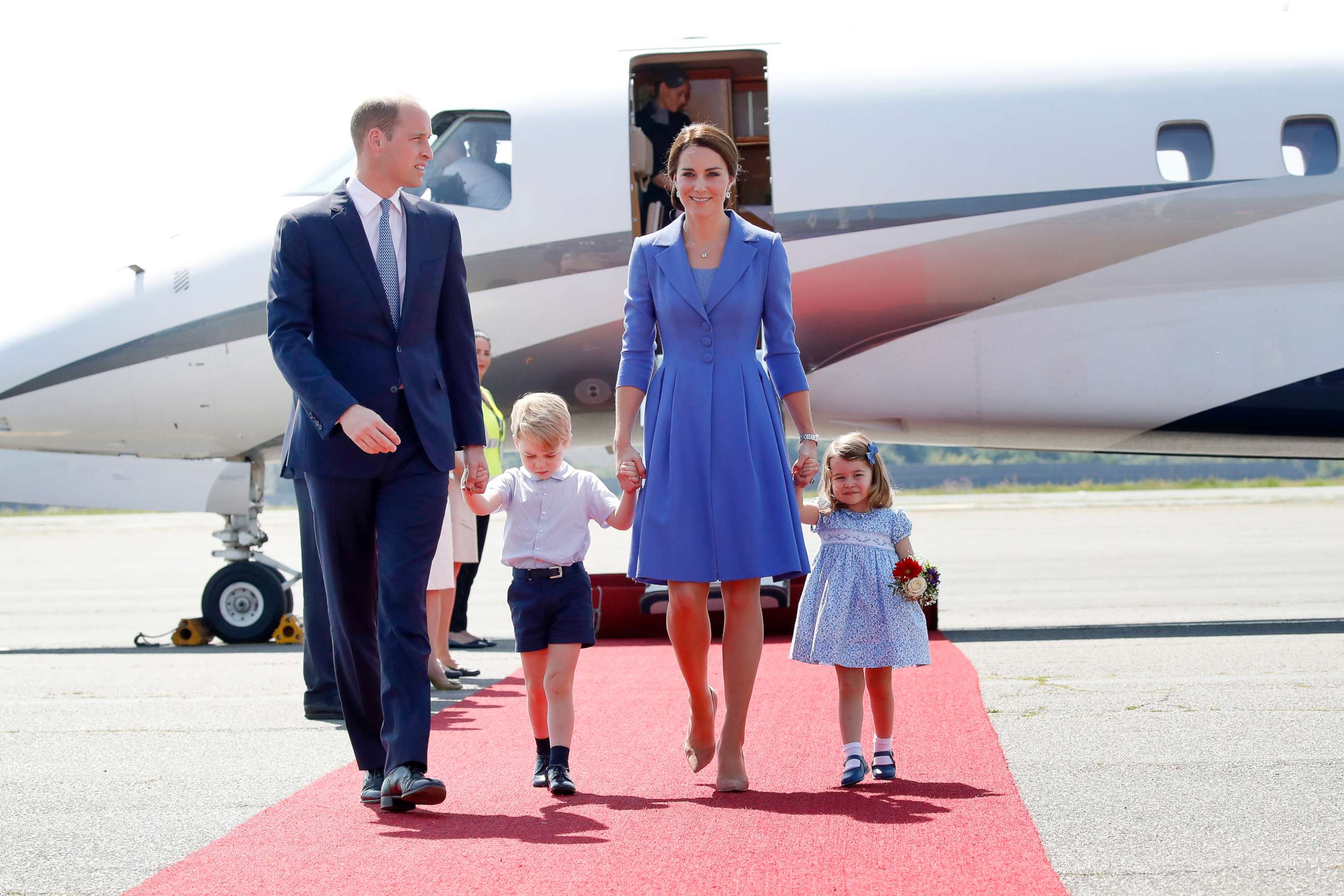 PHOTO: Prince William, Duke of Cambridge, Catherine, Duchess of Cambridge, Prince George of Cambridge and Princess Charlotte of Cambridge arrive at Berlin Tegel Airport during an official visit to Poland and Germany on July 19, 2017 in Berlin.