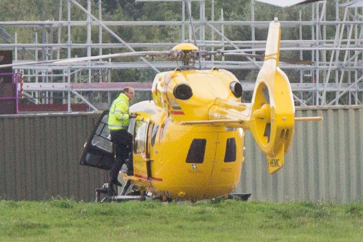 PHOTO: Prince William on his penultimate shift as a pilot checking the air ambulance at Cambridge airport before he hands it over to the night shift, on July 26, 2017, at East Anglian Air Ambulance, Cambridge, U.K.
