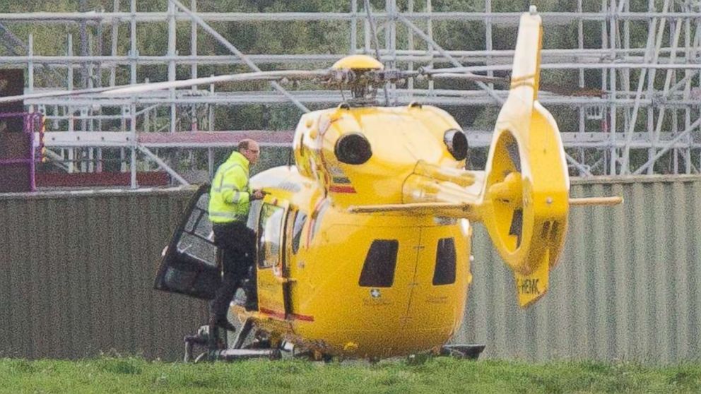 PHOTO: Prince William on his penultimate shift as a pilot checking the air ambulance at Cambridge airport before he hands it over to the night shift, on July 26, 2017, at East Anglian Air Ambulance, Cambridge, U.K.
