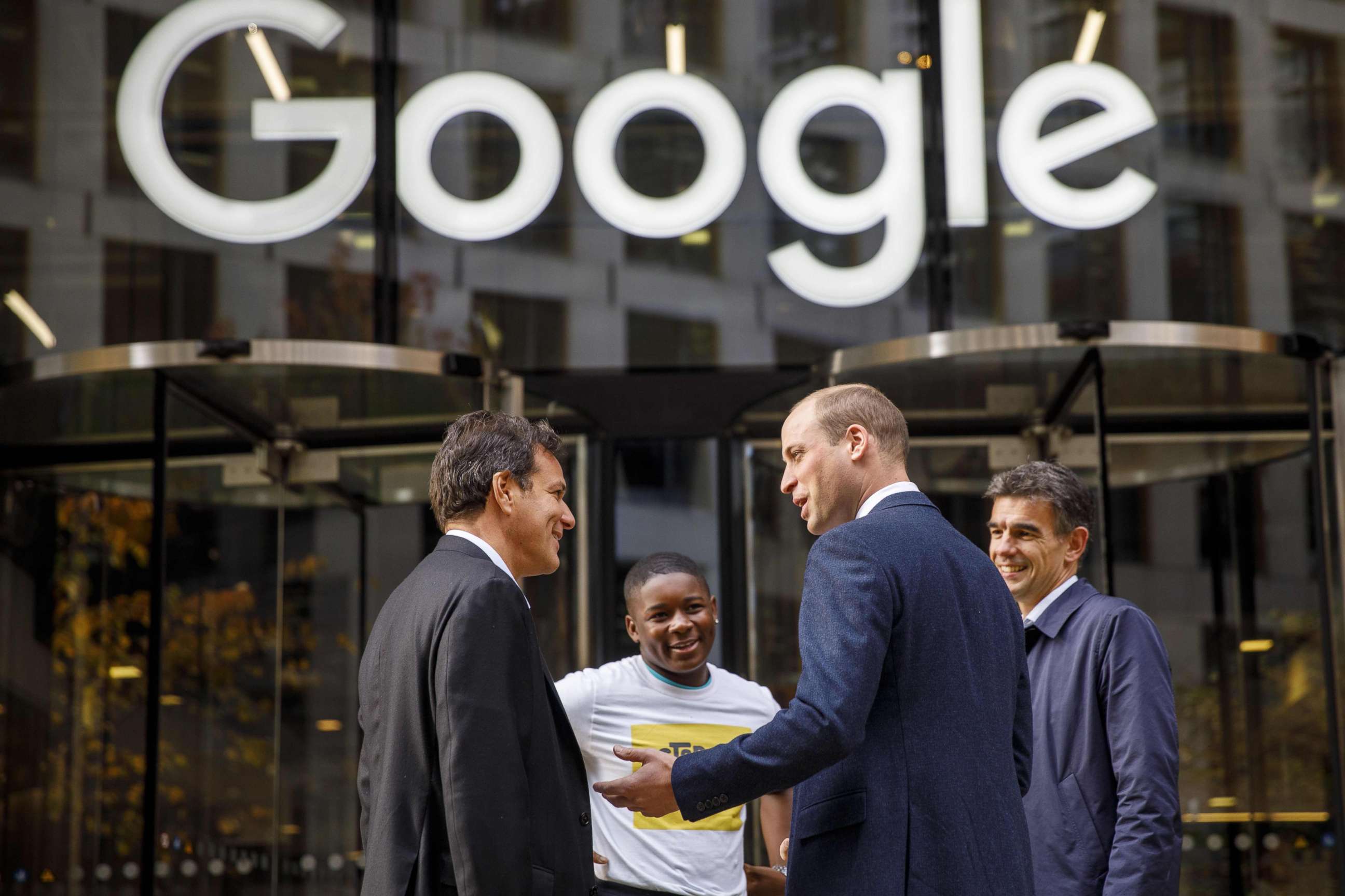 Prince William (2R) chats with British entrepreneur Brent Hoberman (L), anti-cyber bullying campaigner James Okulaja (2L) and Google's EMEA president of business operations, Matt Brittin, at the London headquarters, Nov. 16, 2017.