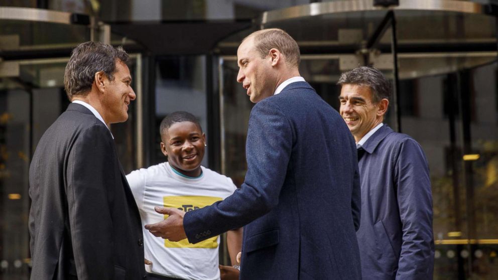 Prince William (2R) chats with British entrepreneur Brent Hoberman (L), anti-cyber bullying campaigner James Okulaja (2L) and Google's EMEA president of business operations, Matt Brittin, at the London headquarters, Nov. 16, 2017.