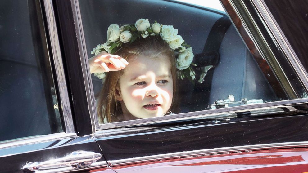 PHOTO: Princess Charlotte of Cambridge arrives at the wedding of Prince Harry to Ms Meghan Markle at St George's Chapel, Windsor Castle on May 19, 2018 in Windsor.  
