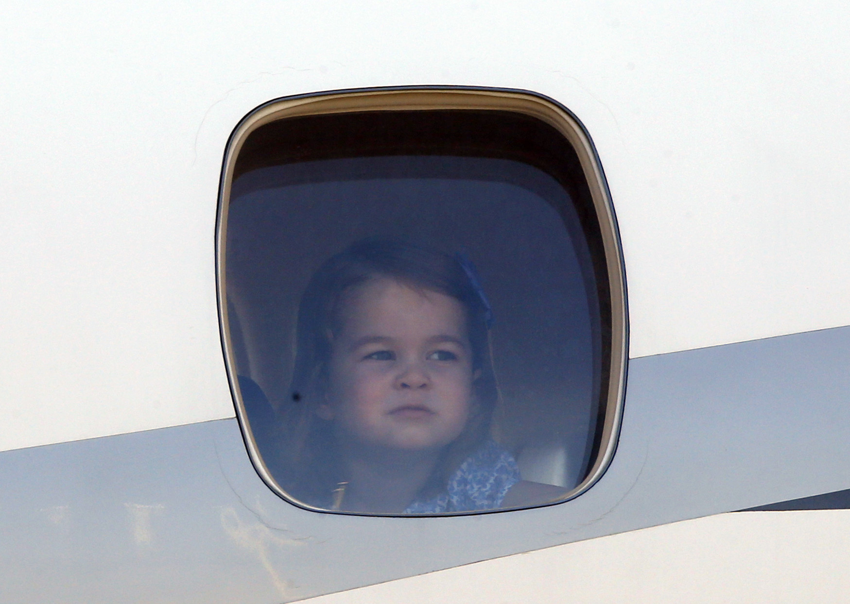 PHOTO:  Princess Charlotte arrives with her royal family  at the Tegel airport in Berlin, July 19, 2017.