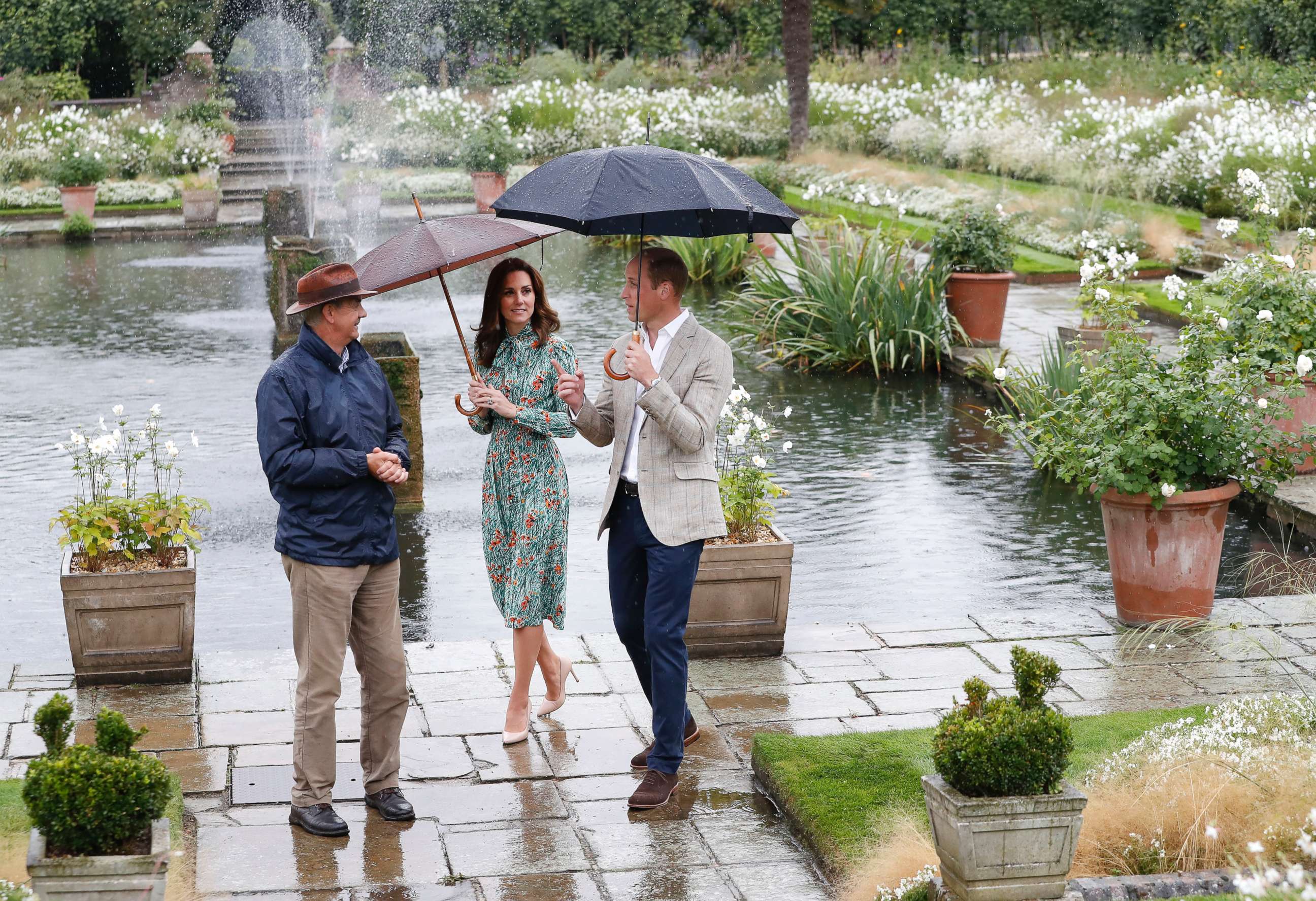 PHOTO: Britain's Prince William, and his wife Kate, Duchess of Cambridge are given a tour at the memorial garden in Kensington Palace, London, Aug. 30, 2017. 