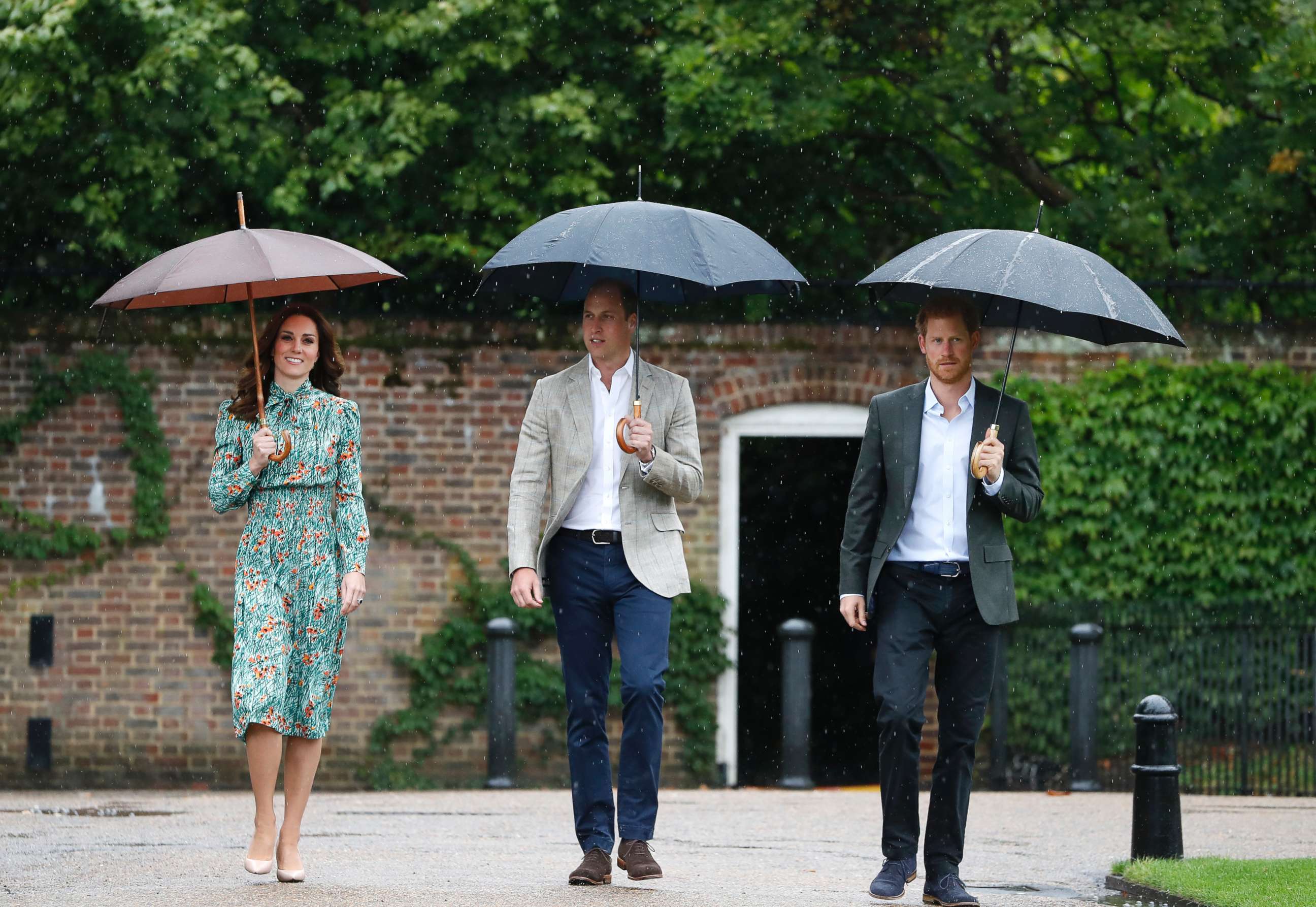 PHOTO: Britain's Prince William, Kate, Duchess of Cambridge and Prince Harry arrive for an event at the memorial garden in Kensington Palace, London, Aug. 30, 2017. 