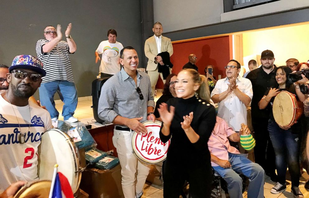 PHOTO: Jennifer Lopez and Alex Rodriguez play music with people in Puerto Rico.