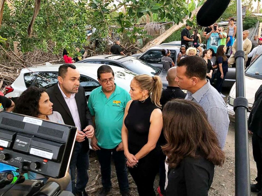 PHOTO: Jennifer Lopez and Alex Rodriguez talk with residents of Puerto Rico about the island's recovery from Hurricane Maria.