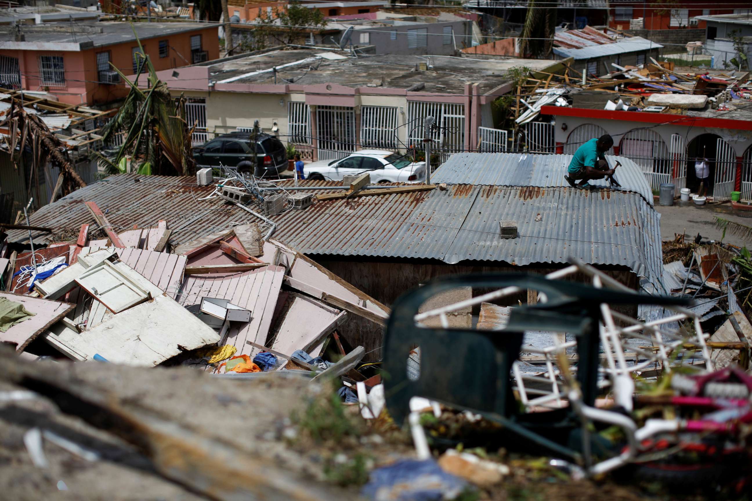 PHOTO: A man tries to rebuild his house after the area was hit by Hurricane Maria in Canovanas, Puerto Rico, Sept. 26, 2017.