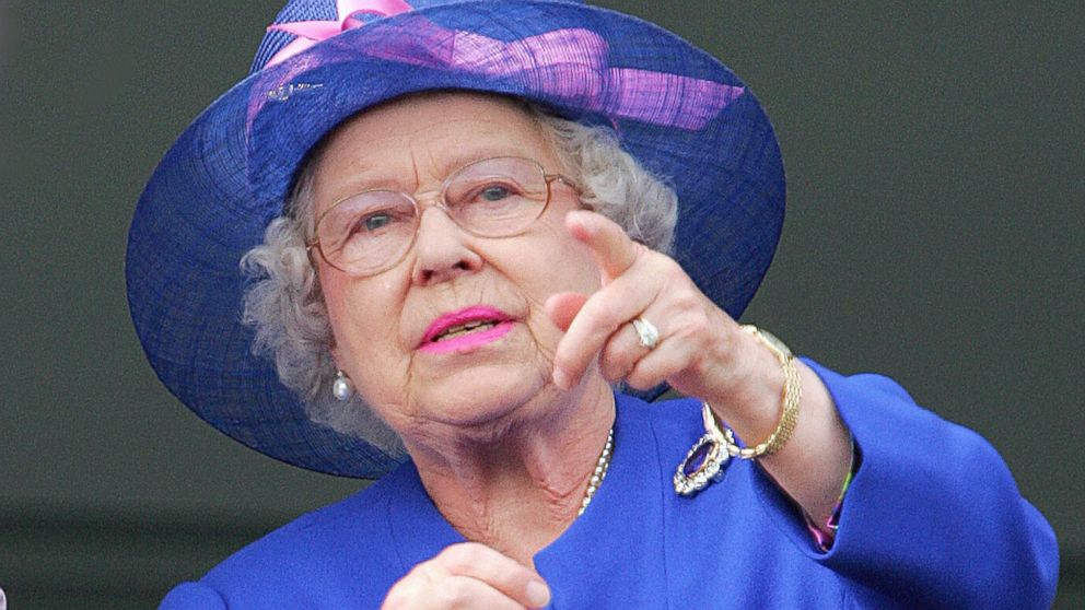 PHOTO: Queen Elizabeth II gestures as Jockey Frankie Detorri crosses the finish line to win the Vodafone Derby at the annual Vodafone Derby horse race at Epsom Downs, Surrey, June 2, 2007.