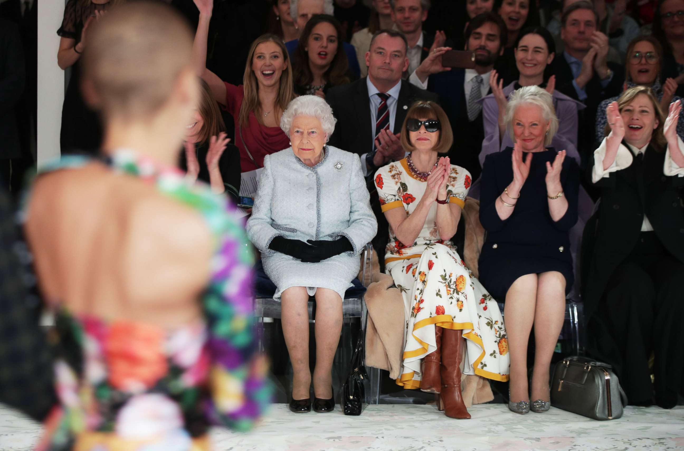 PHOTO: Queen Elizabeth II views British designer Richard Quinn's runway show before presenting him with the inaugural Queen Elizabeth II Award for British Design, during her visit to London Fashion Week's BFC Show Space in central London, Feb. 20, 2018. 