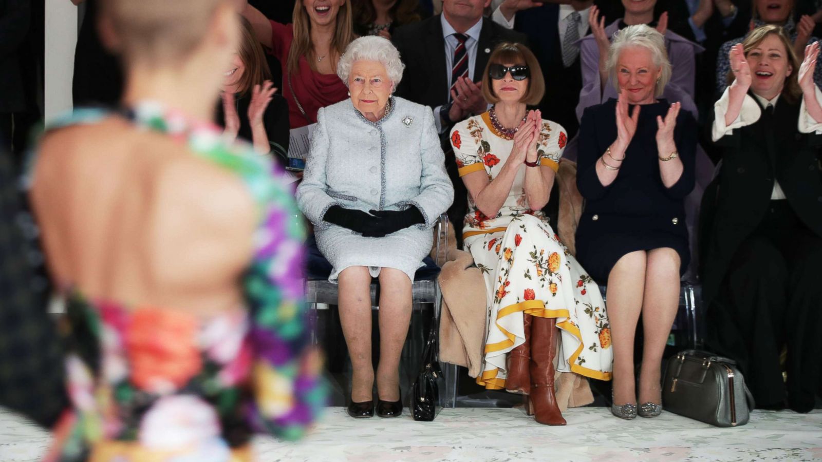 PHOTO: Queen Elizabeth II views British designer Richard Quinn's runway show before presenting him with the inaugural Queen Elizabeth II Award for British Design, during her visit to London Fashion Week's BFC Show Space in central London, Feb. 20, 2018.