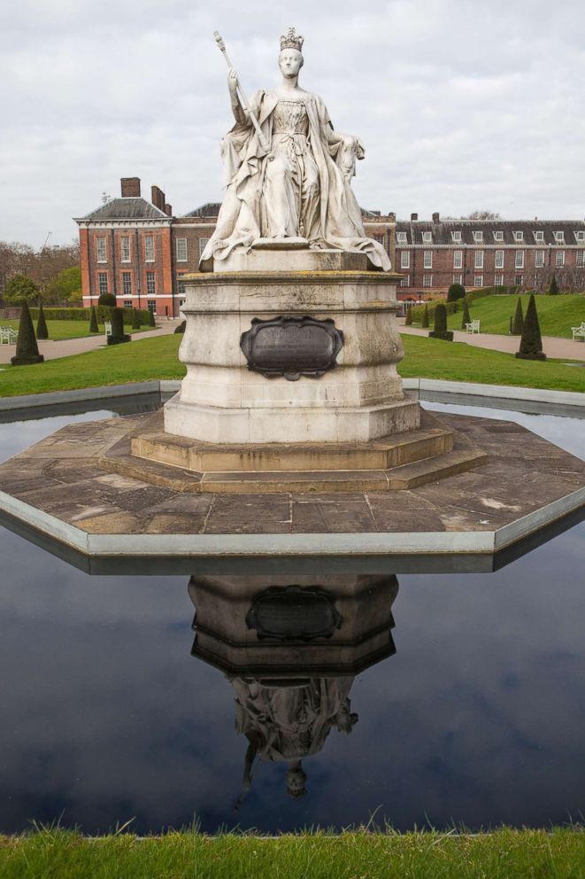 PHOTO: A statue of Queen Victoria stands behind Kensington Palace in Kensington Gardens, April 19, 2016, in London.