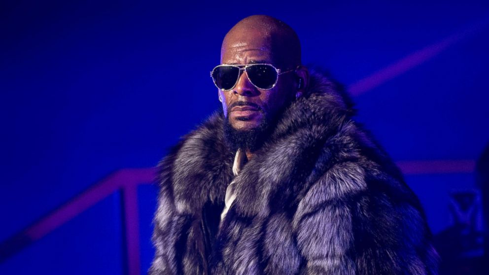 In this Dec. 17, 2016, file photo, R. Kelly performs in concert during the '12 Nights Of Christmas' tour at Kings Theatre in Brooklyn, New York.