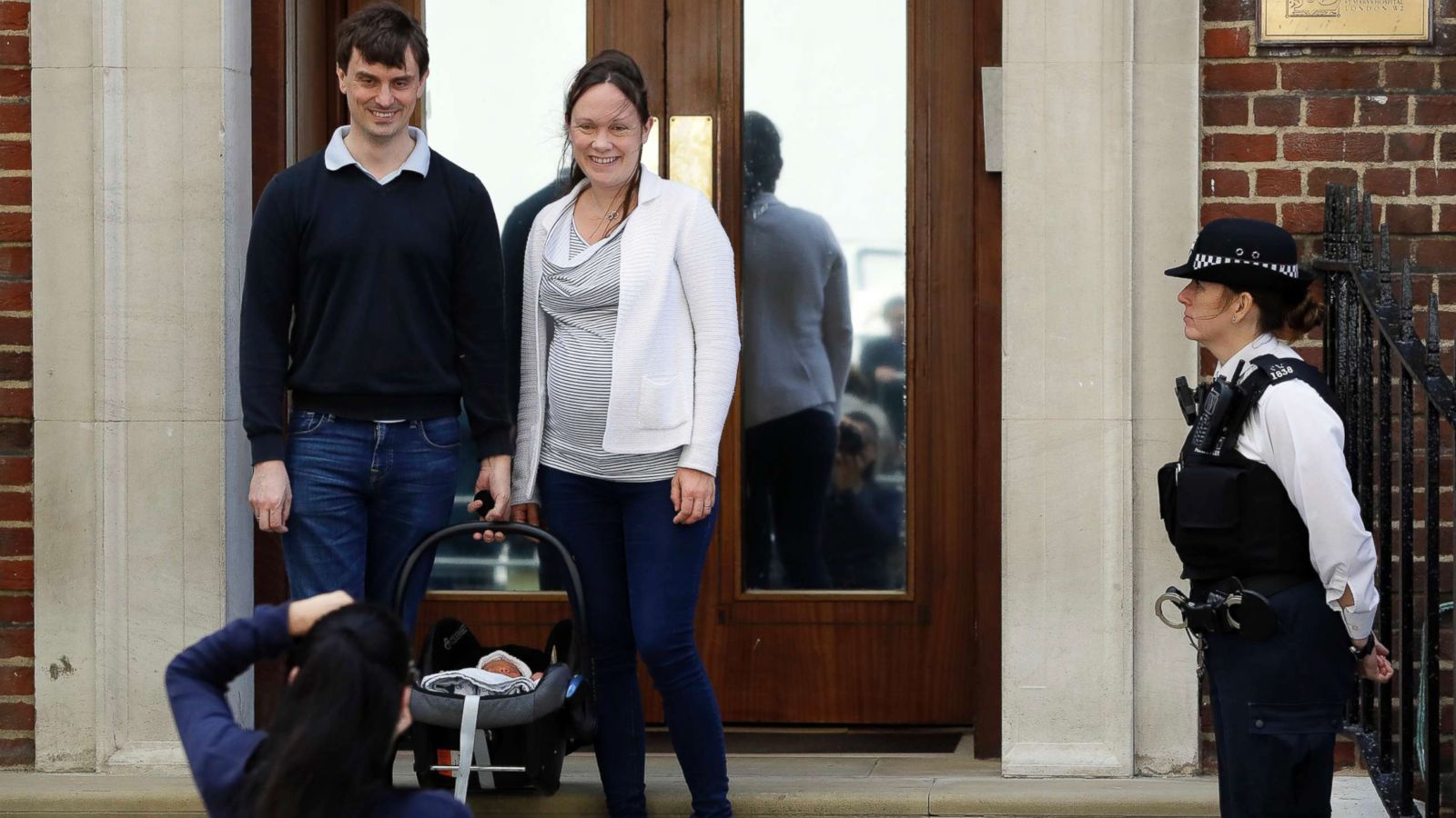 PHOTO: A couple pose for a photo with their newborn baby as they leave the Lindo wing at St Mary's Hospital in London, April 23, 2018.