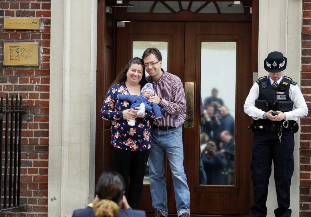 PHOTO: A couple pose for a photo with their newborn baby as they leave the Lindo wing at St Mary's Hospital in London, April 23, 2018.